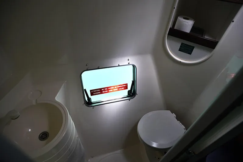 Mersea Yacht Photos Pics Bathroom interior of 1997 Fountaine Pajot Athena 38 catamaran with sink and toilet.