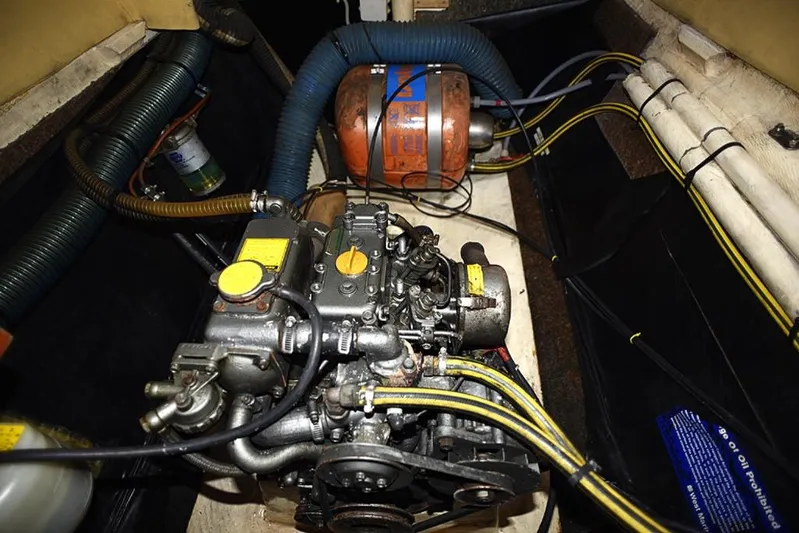 Mersea Yacht Photos Pics Engine compartment of a 1997 Fountaine Pajot Athena 38 catamaran, showcasing mechanical components and wiring.