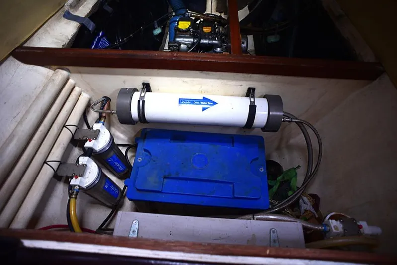 Mersea Yacht Photos Pics Engine compartment of 1997 Fountaine Pajot Athena 38 catamaran with visible components.