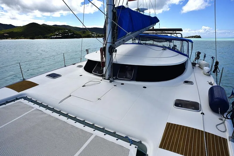 Mersea Yacht Photos Pics Fountaine Pajot Athena 38 catamaran sailing on calm waters, 1997 model.