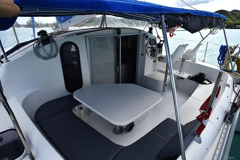 Mersea Yacht Photos Pics 1997 Fountaine Pajot Athena 38 catamaran with spacious cockpit and seating area.