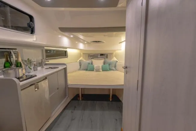 Ready For Immediate Delivery Yacht Photos Pics Luxurious interior of 2025 Hanover 387 Grey & Black Edition Outboard boat cabin.