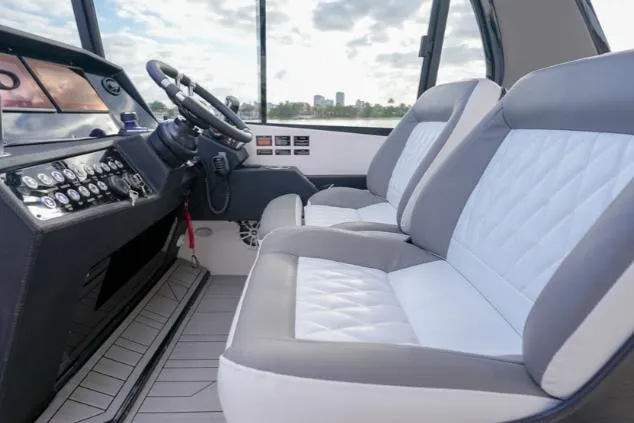 Ready For Immediate Delivery Yacht Photos Pics Interior of 2025 Hanover 387 Grey & Black Edition Outboard, featuring modern seating and controls.