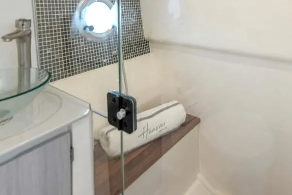 Ready For Immediate Delivery Yacht Photos Pics Interior of 2025 Hanover 387 Grey & Black Edition Outboard, featuring modern bathroom design.