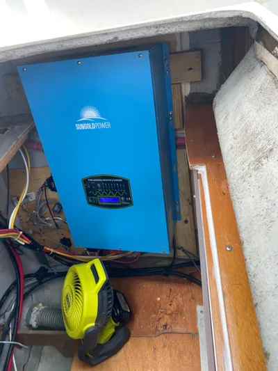 Hh Sound Waves Yacht Photos Pics Blue solar power inverter in a 2008 Lagoon 420 Hybrid boat's engine compartment.