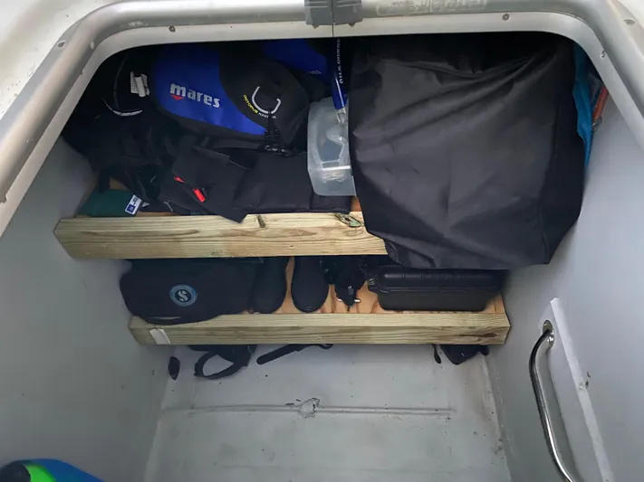 Hh Sound Waves Yacht Photos Pics Storage compartment in a 2008 Lagoon 420 Hybrid, filled with diving gear and equipment.