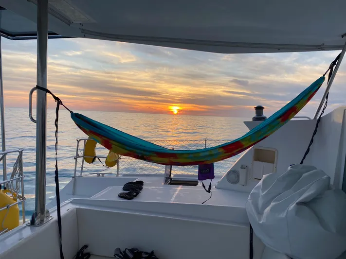 Hh Sound Waves Yacht Photos Pics Hammock on Lagoon 420 Hybrid yacht at sunset over the ocean, 2008 model.