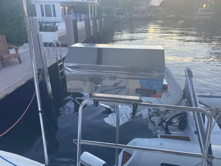 Hh Sound Waves Yacht Photos Pics Stainless steel grill on a 2008 Lagoon 420 Hybrid yacht docked by the water.