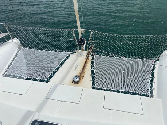 Hh Sound Waves Yacht Photos Pics Catamaran deck with netting, Lagoon 420 Hybrid, 2008 model, on calm water.