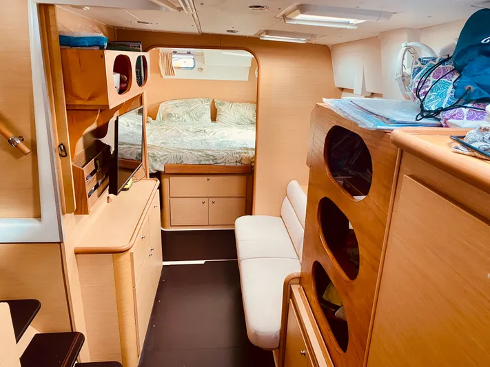 Hh Sound Waves Yacht Photos Pics Interior of 2008 Lagoon 420 Hybrid yacht, featuring cozy cabin and wooden furnishings.