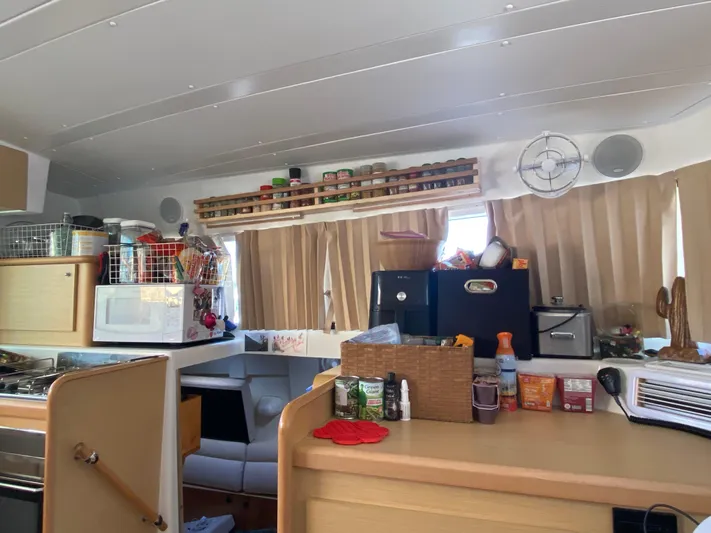 Hh Sound Waves Yacht Photos Pics Interior of 2008 Lagoon 420 Hybrid yacht with kitchen and storage.