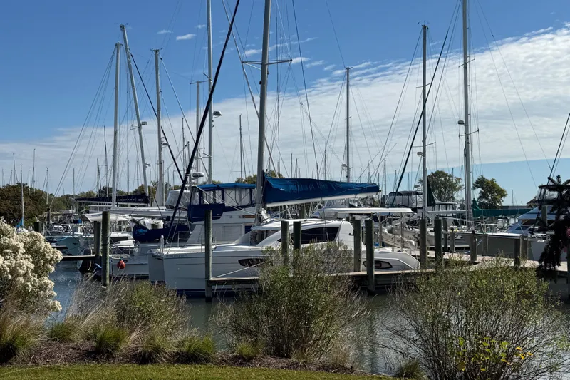 Way Maker Yacht Photos Pics Boats docked at a marina under a clear blue sky, featuring a 2010 Leopard 38.
