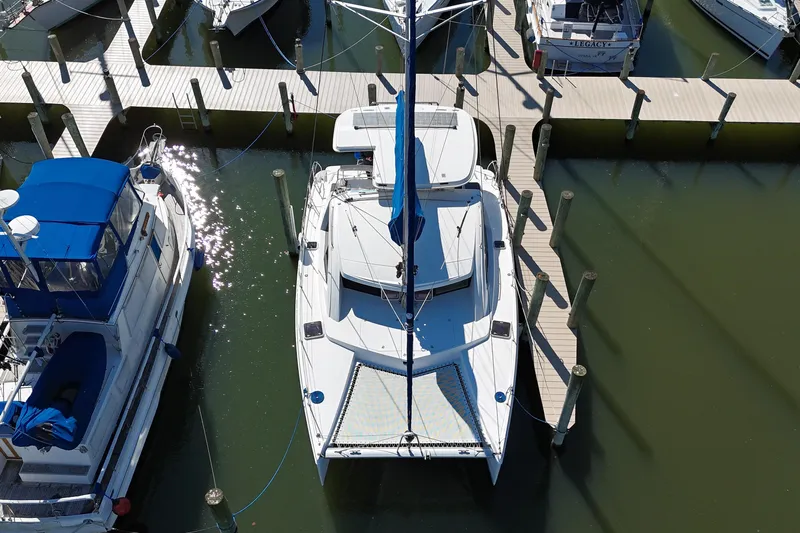 Way Maker Yacht Photos Pics Aerial view of a 2010 Leopard 38 catamaran docked at a marina.