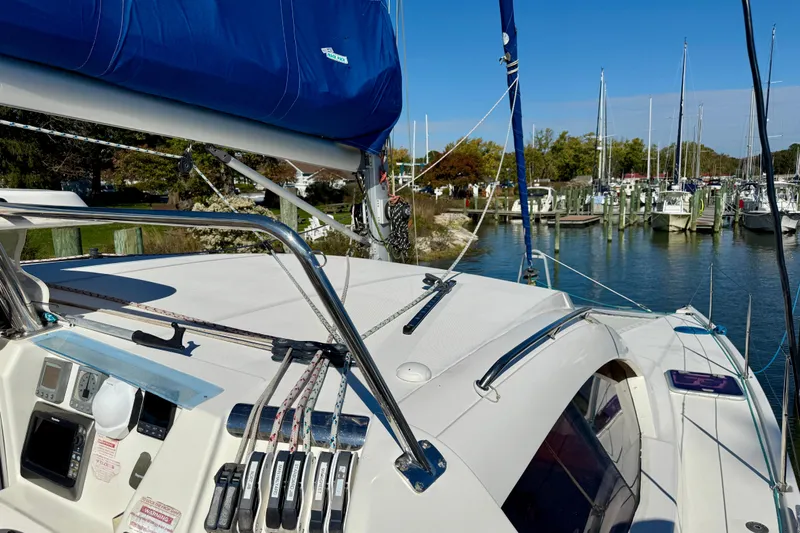 Way Maker Yacht Photos Pics Sailing yacht Leopard 38, 2010 model, docked in a marina under clear blue skies.