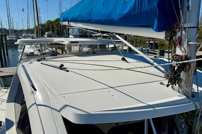 Way Maker Yacht Photos Pics 2010 Leopard 38 catamaran docked at marina, featuring blue sail cover and rigging.