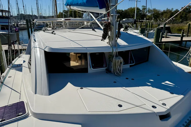 Way Maker Yacht Photos Pics 2010 Leopard 38 catamaran docked at marina, showcasing sleek deck design.