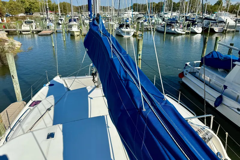 Way Maker Yacht Photos Pics Sailboat docked in marina, Leopard 38 model, 2010, with blue sail cover.