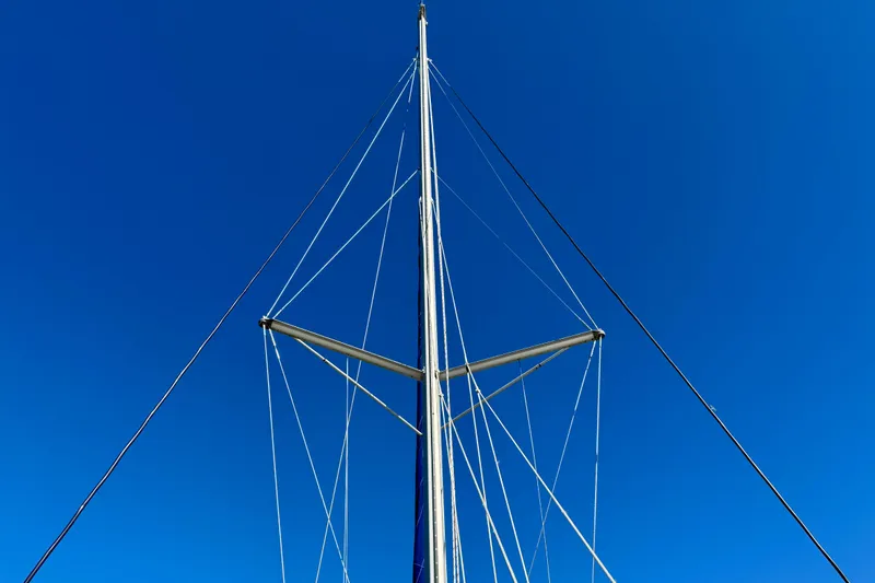 Way Maker Yacht Photos Pics Mast of 2010 Leopard 38 sailboat against clear blue sky.