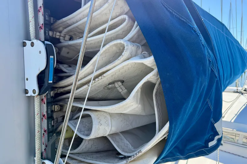 Way Maker Yacht Photos Pics Folded sail on a 2010 Leopard 38 catamaran, covered with a blue sail cover.