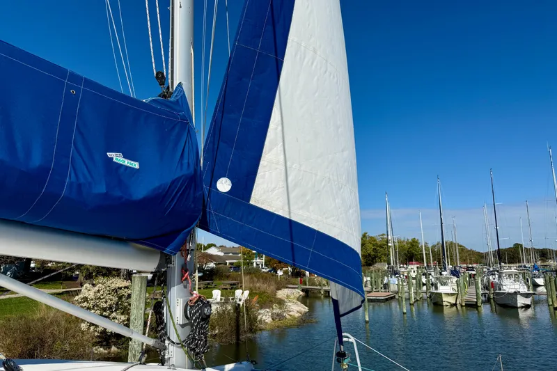 Way Maker Yacht Photos Pics Sailboat in marina with blue sail cover, Leopard 38 model, 2010.