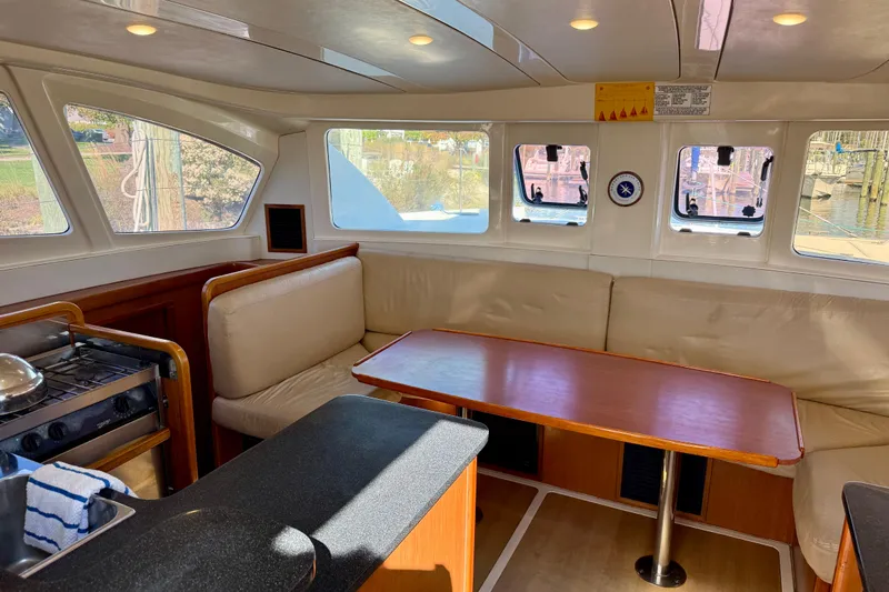 Way Maker Yacht Photos Pics Interior of 2010 Leopard 38 catamaran with dining area and kitchen.