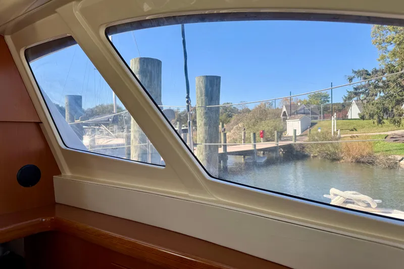 Way Maker Yacht Photos Pics Interior view from a 2010 Leopard 38 yacht, overlooking a serene marina.