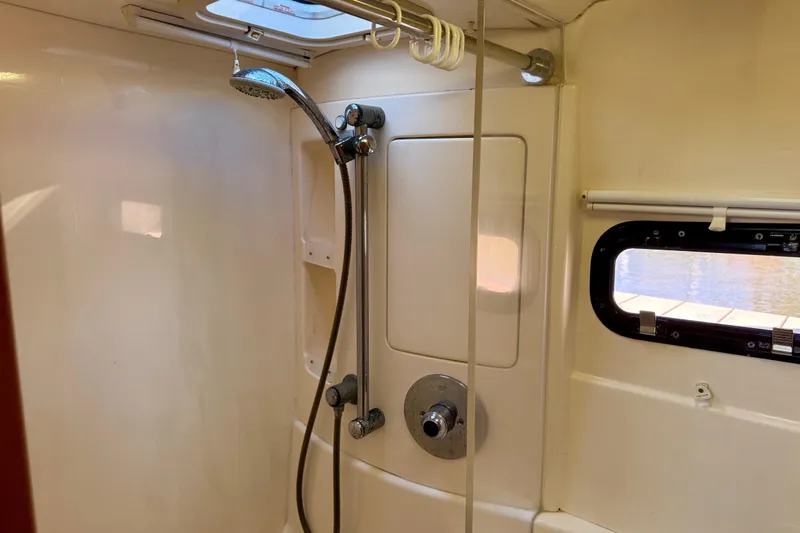 Way Maker Yacht Photos Pics Shower area in 2010 Leopard 38 yacht with window and skylight.