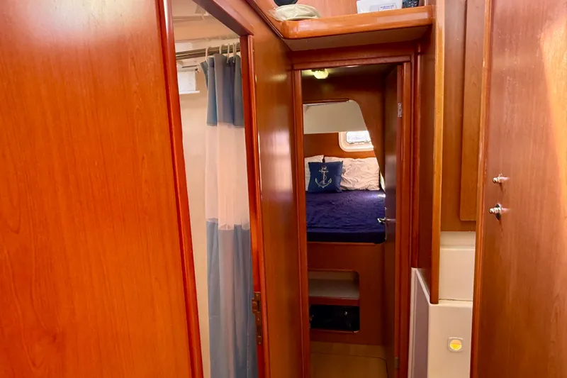 Way Maker Yacht Photos Pics Interior of 2010 Leopard 38 yacht showing cozy cabin with wooden finish.