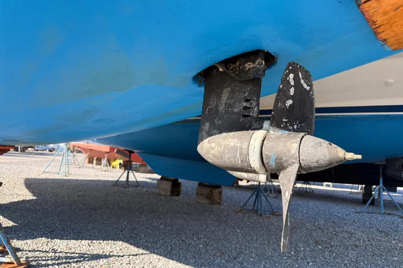 Way Maker Yacht Photos Pics Propeller of a 2010 Leopard 38 catamaran on dry dock, showing wear and marine growth.