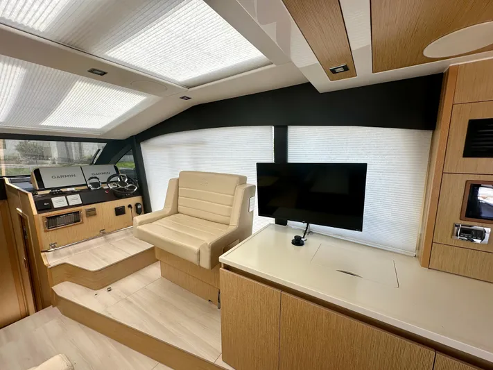 Nan Sea Cay Yacht Photos Pics Luxurious interior of 2020 Sealine C430 yacht with modern helm and seating area.