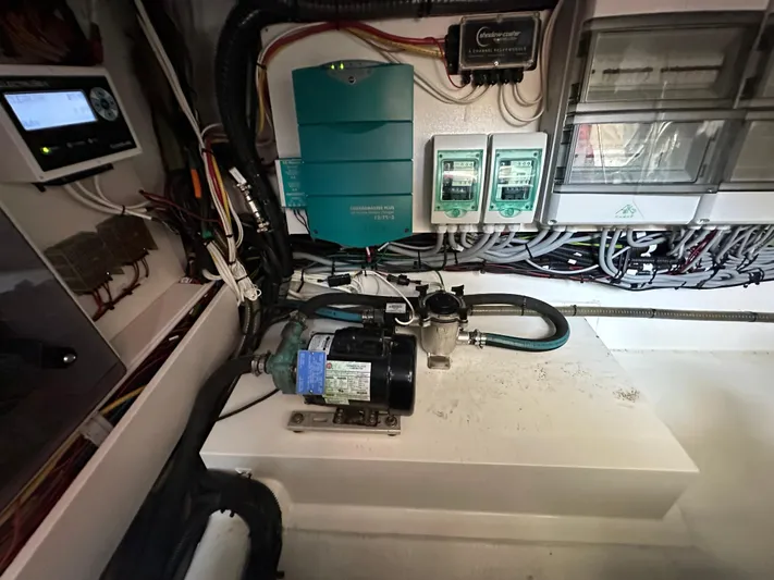Nan Sea Cay Yacht Photos Pics Engine room of a 2020 Sealine C430 yacht, featuring electrical components and wiring.
