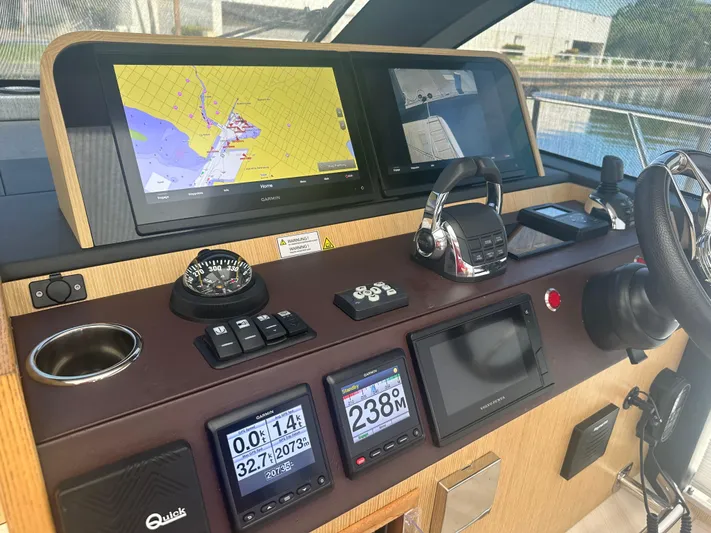 Nan Sea Cay Yacht Photos Pics Helm of 2020 Sealine C430 yacht with navigation screens and controls.