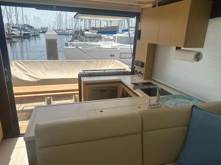 Nan Sea Cay Yacht Photos Pics Interior view of 2020 Sealine C430 yacht with marina backdrop.