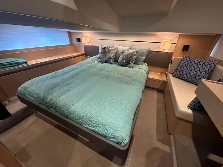 Nan Sea Cay Yacht Photos Pics Luxurious bedroom interior of 2020 Sealine C430 yacht with elegant bedding and seating.