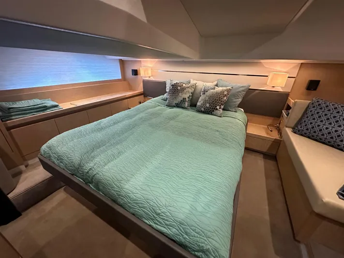 Nan Sea Cay Yacht Photos Pics Luxurious bedroom interior of 2020 Sealine C430 yacht with elegant bedding and ambient lighting.