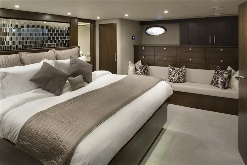 Encore Yacht Photos Pics Luxurious yacht bedroom with elegant decor, plush bedding, and modern furnishings, Crescent Custom 1992.