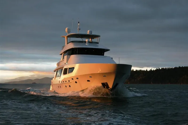 Encore Yacht Photos Pics Luxurious 1992 Crescent Custom yacht cruising at sunset on open water.