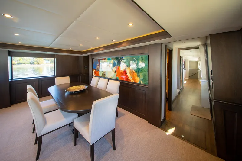 Encore Yacht Photos Pics Luxurious 1992 Crescent Custom yacht interior with elegant dining area and modern artwork.