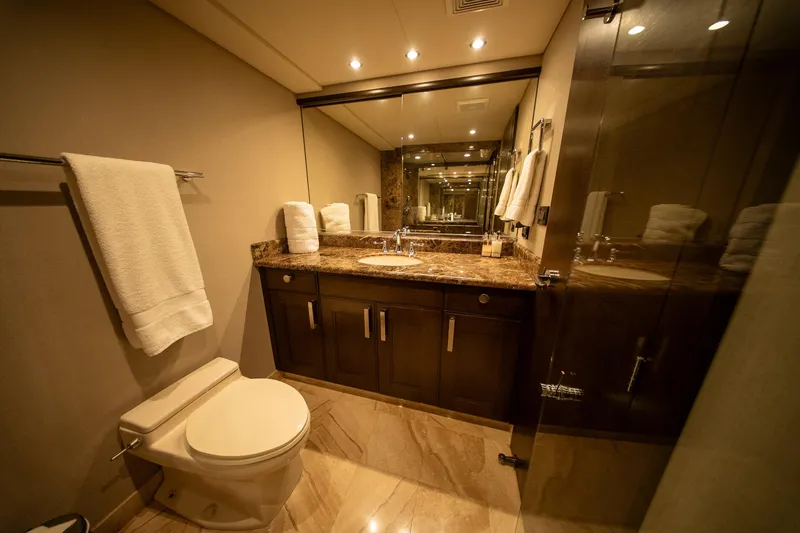 Encore Yacht Photos Pics Luxurious bathroom with marble countertop, elegant lighting, and modern fixtures in a 1992 Crescent Custom.
