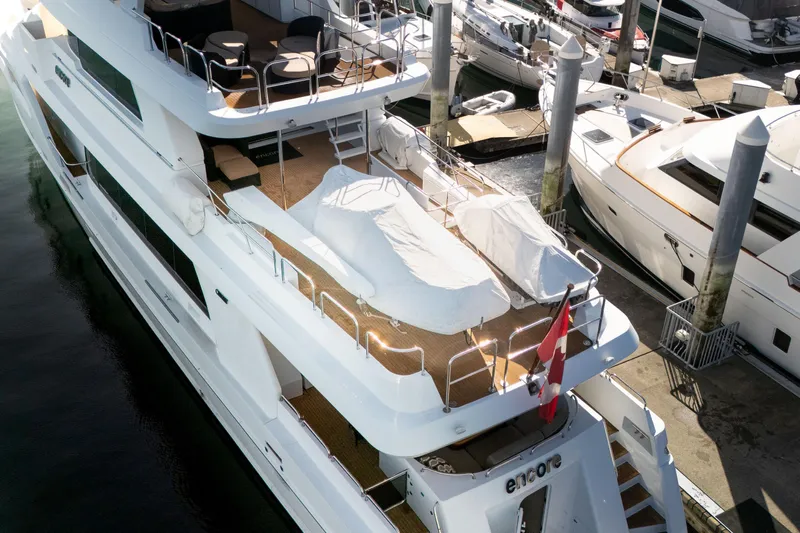 Encore Yacht Photos Pics Luxurious 1992 Crescent Custom yacht docked, featuring spacious decks and elegant design.