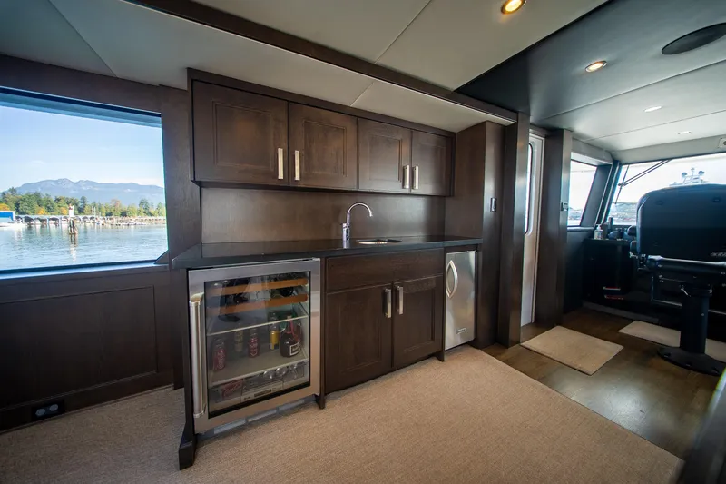 Encore Yacht Photos Pics Luxurious 1992 Crescent Custom yacht interior with kitchenette and scenic window view.