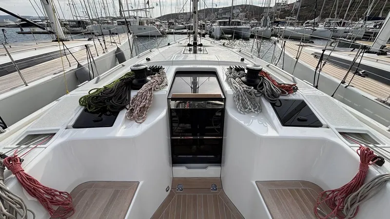 Zenith Yacht Photos Pics Italia Yachts 14.98 (2023) sailboat deck with ropes and winches in a marina.