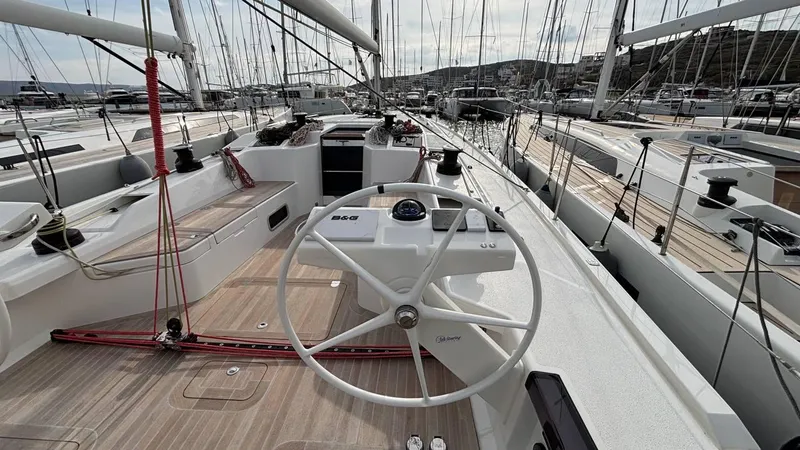 Zenith Yacht Photos Pics Italia Yachts 14.98 sailboat deck, 2023 model, featuring a sleek steering wheel and modern design.