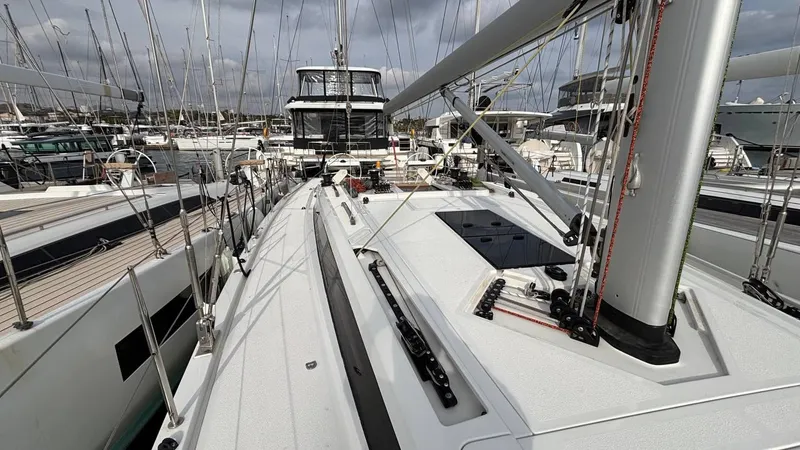 Zenith Yacht Photos Pics Italia Yachts 14.98 sailboat, 2023 model, docked in a marina with other boats.