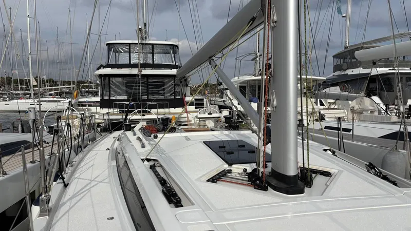 Zenith Yacht Photos Pics Italia Yachts 14.98 sailboat, 2023 model, docked in a marina with other boats.