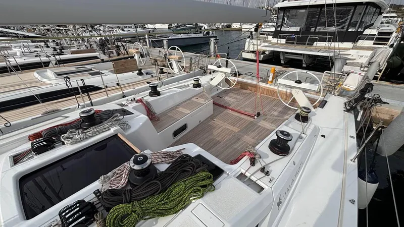 Zenith Yacht Photos Pics Italia Yachts 14.98, 2023 model, docked with visible deck and steering wheels.