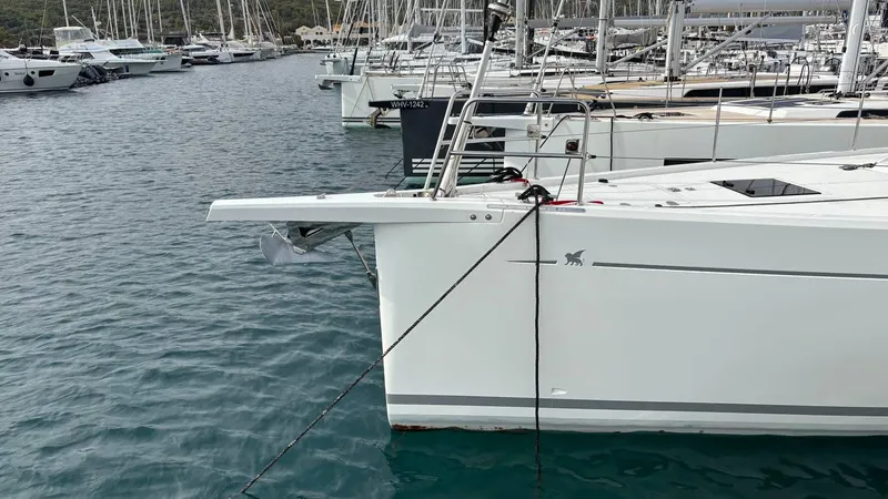 Zenith Yacht Photos Pics Italia Yachts 14.98, 2023 model, docked in a marina with other sailboats.