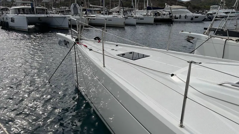 Zenith Yacht Photos Pics Italia Yachts 14.98 (2023) docked in a marina, surrounded by other boats.