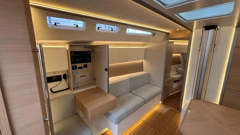 Zenith Yacht Photos Pics Luxurious interior of 2023 Italia Yachts 14.98, featuring modern seating and ambient lighting.