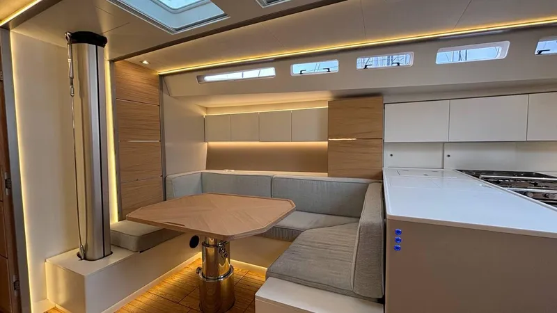 Zenith Yacht Photos Pics Luxurious interior of 2023 Italia Yachts 14.98, featuring modern seating and elegant lighting.
